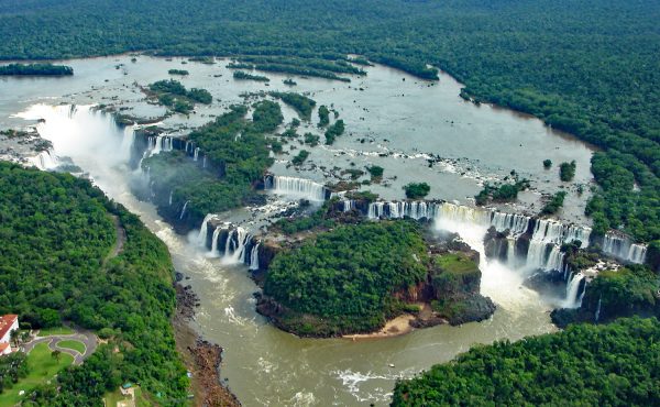 The wide cascades of Iguazu Falls surrounded by rainforest