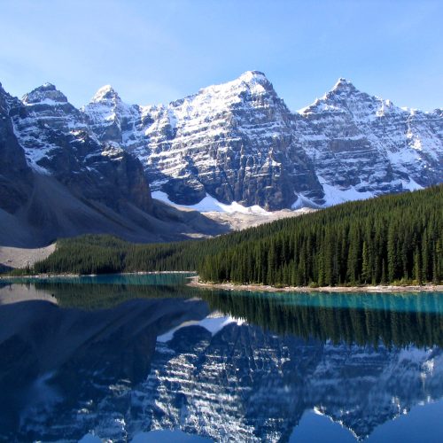 Turquoise Moraine Lake below snow-capped peaks in Banff National Park Turquoise Moraine Lake below snow-capped peaks in Banff National Park