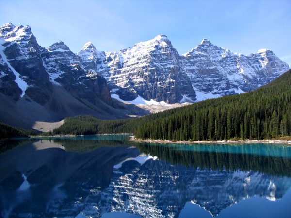 Turquoise Moraine Lake below snow-capped peaks in Banff National Park Turquoise Moraine Lake below snow-capped peaks in Banff National Park