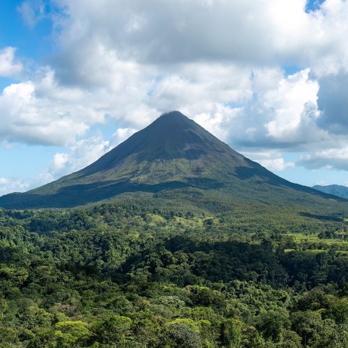 The cone of Arenal Volcano above rainforest and hot springs The cone of Arenal Volcano above rainforest and hot springs