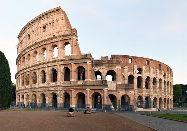 The Roman Colosseum lit by warm evening light The Roman Colosseum lit by warm evening light