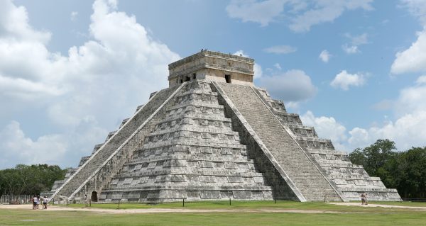 El Castillo pyramid at Chichen Itza under a clear blue sky El Castillo pyramid at Chichen Itza under a clear blue sky